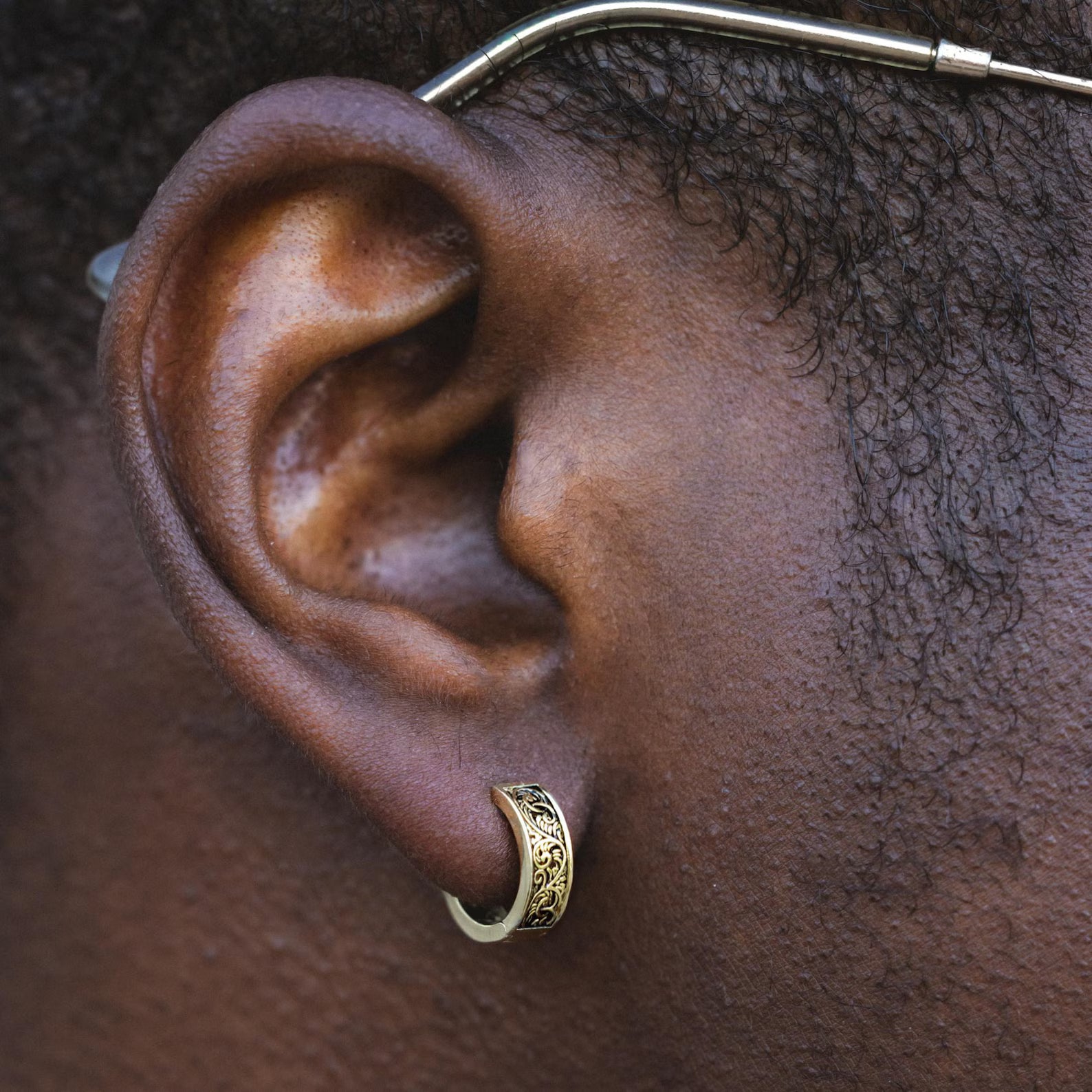 Ornate Huggie Hoop Earring – Gold Tone